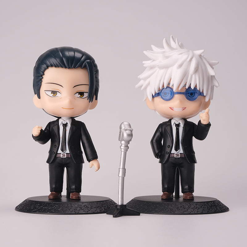 The Jujutsu Kaisen Gojo Satoru &amp; Suguru Geto 10-Piece Action Figure Set features chibi-style figures in black suits with unique hairstyles. A silver microphone adds charm to this exquisite anime collectible duo, perfect for fans of the series.