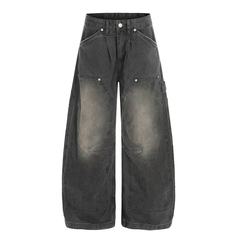 Front view of washed black wide-leg cargo denim pants with oversized pockets