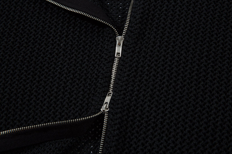 Black front zipper detail on mesh knit track jacket close-up