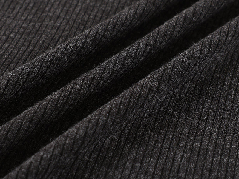 Close-up of black ribbed knit fabric texture