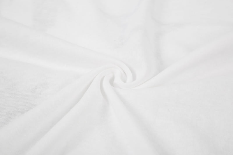 Close-up of white tee fabric swirls and texture