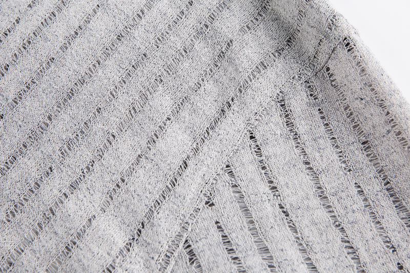 Close-up of gray sheer mesh fabric texture with diagonal open weave