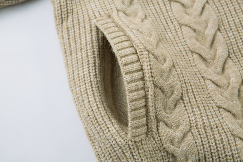 Beige cable knit sweater jacket sleeve cuff and front edge close-up