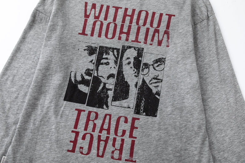 Close-up of back graphic on gray long sleeve tee with bold red text and face panels