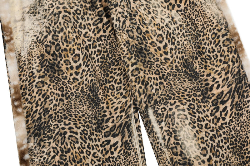Close-up of leopard print fabric across the leg of wide-leg jeans