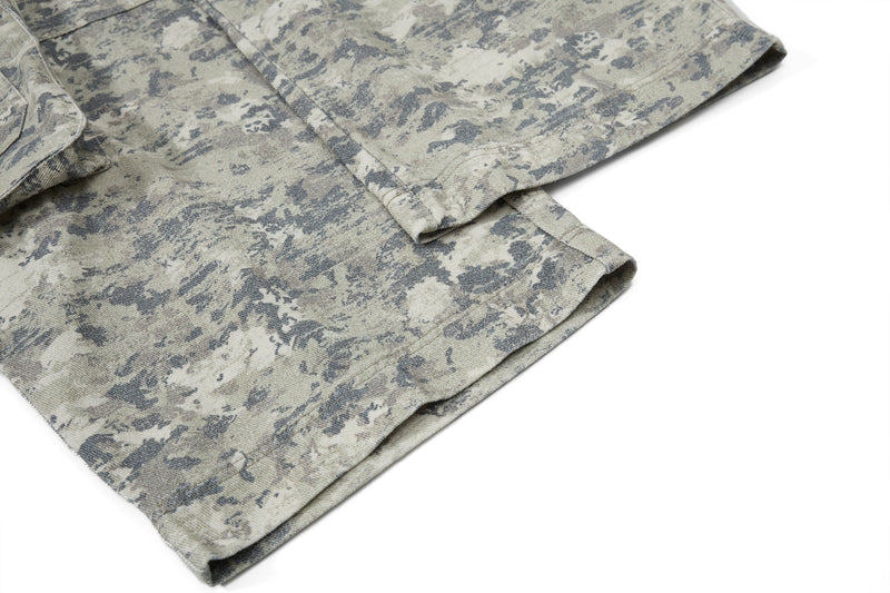 Close-up of hem and lower leg on camouflage wide-leg cargo pants