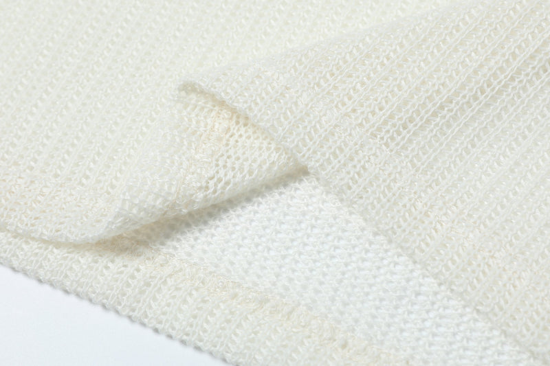 Close-up of cream mesh fabric gathered in a soft fold