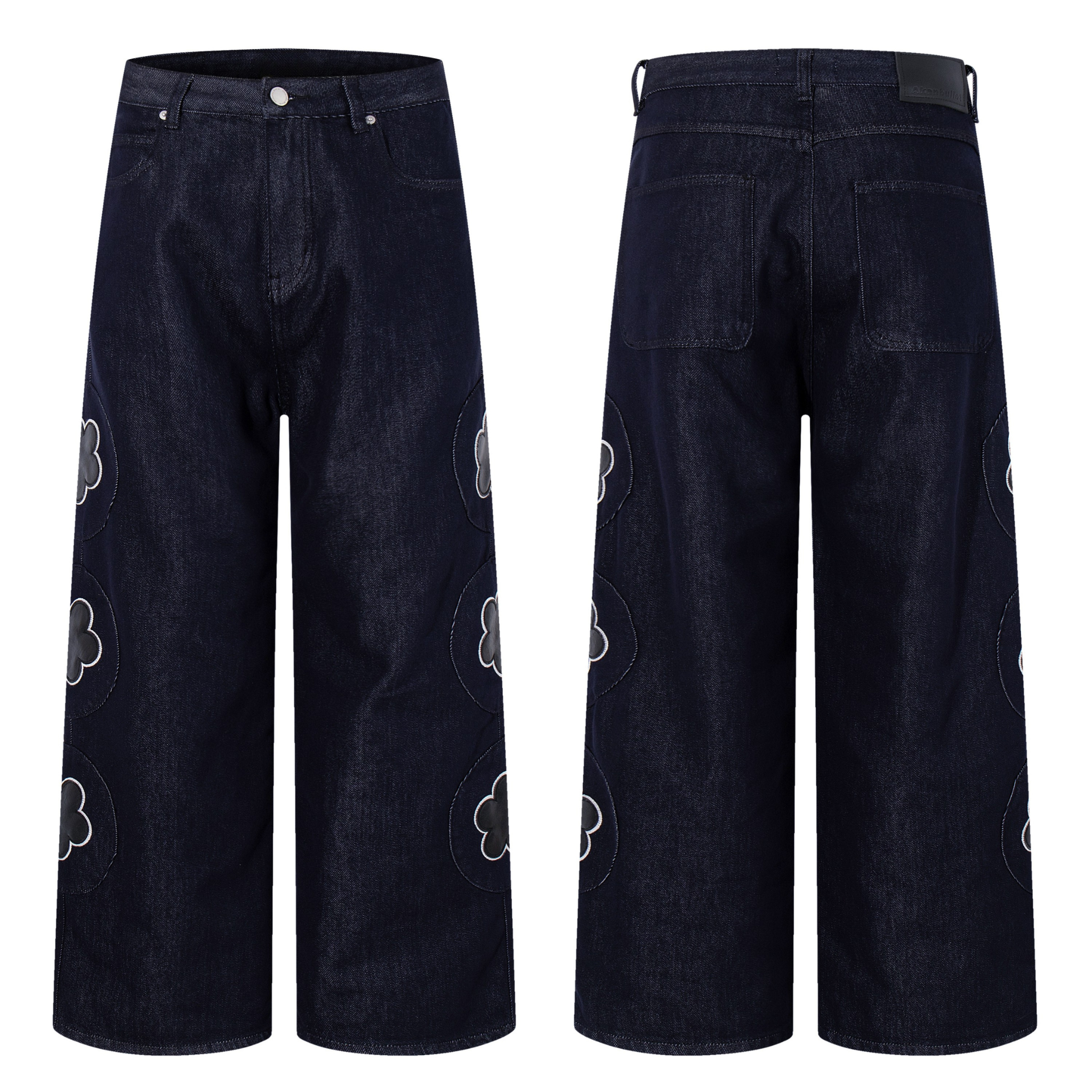 Front and back view of dark indigo wide-leg jeans with oversized tonal floral appliqué patches on both legs