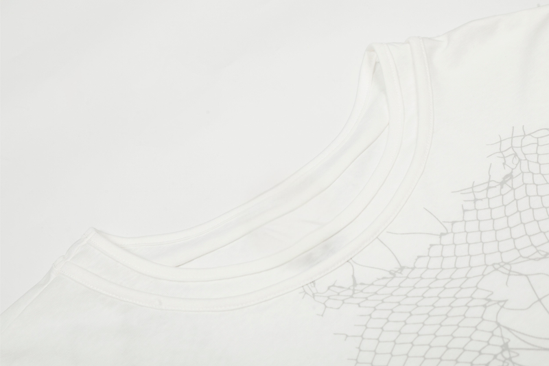 Close-up of white tee neckline and upper front graphic with fine gray line print