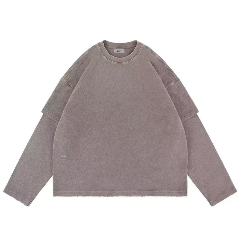 Oversized taupe corduroy crewneck sweatshirt laid flat with wide sleeves