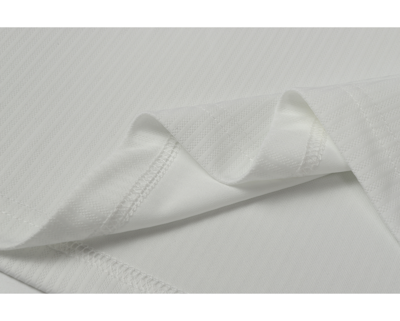 Close-up of white mesh fabric seam and stitched hem