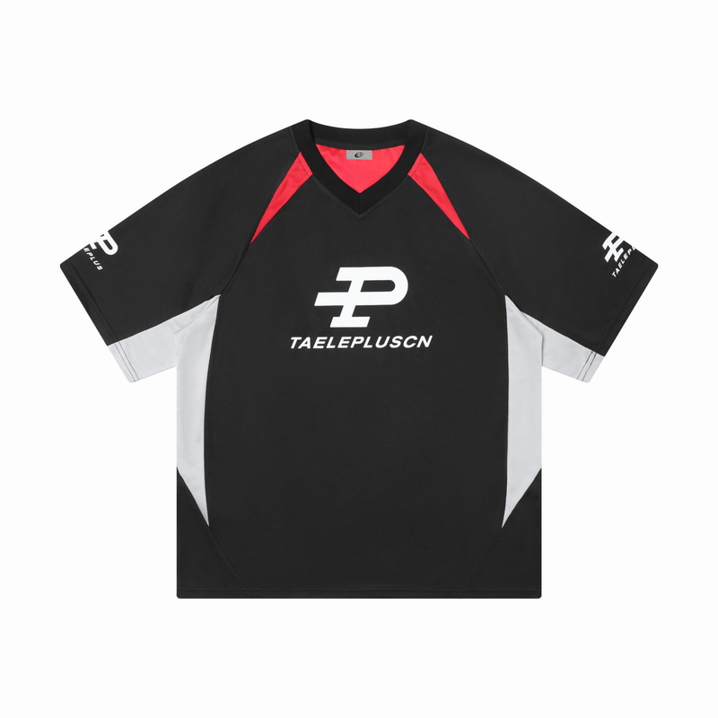 Black colorblock sport jersey tee with red V-neck accents, white side panels, and bold front logo print