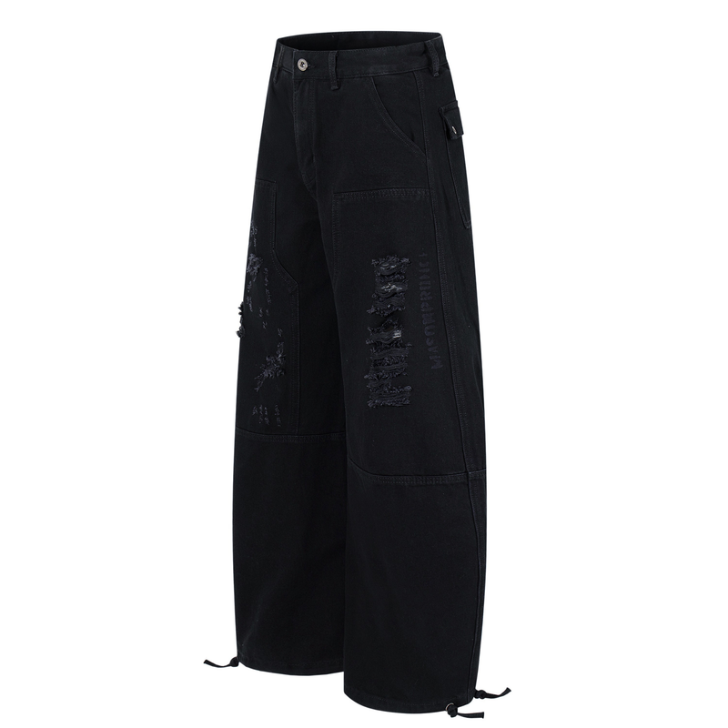 Black distressed denim pants angled front view with side cargo pocket and wide legs