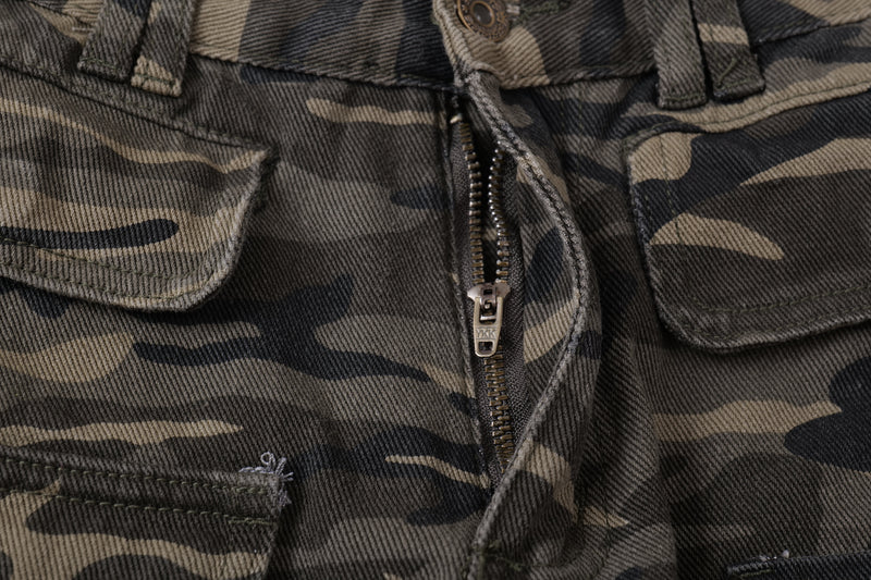Close-up of front fly zipper on camo cargo pants with flap pockets