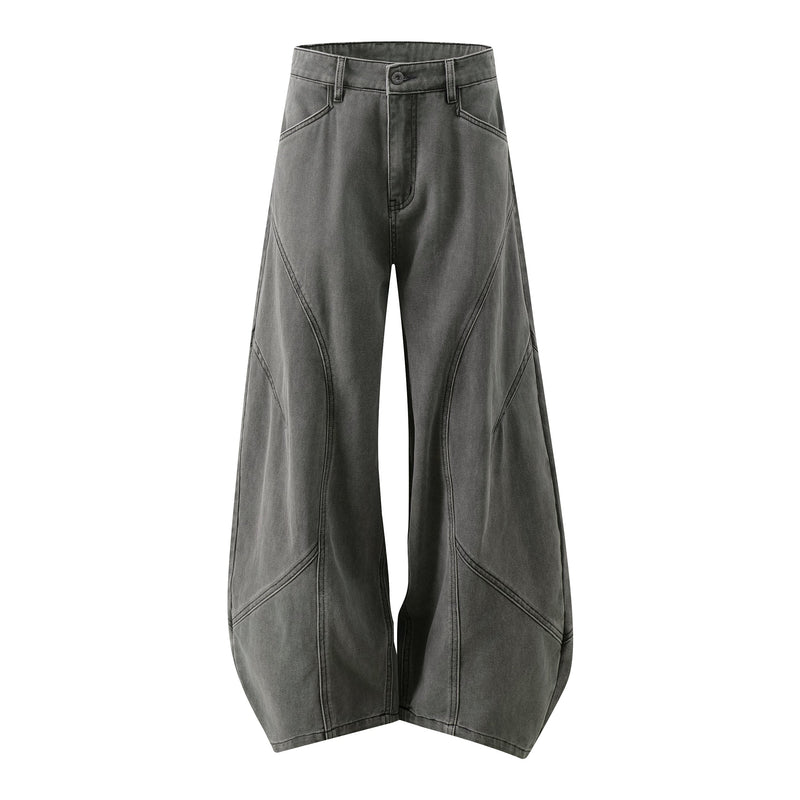 Charcoal gray wide-leg jeans with curved panel seams, front view