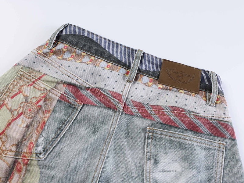 Back waist close-up with leather patch, belt loops, and mixed denim patchwork