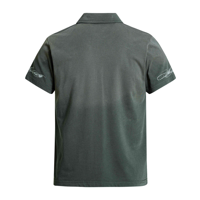 Dark green vintage polo tee with white script graphics on the sleeves, shown from the back on a plain white background