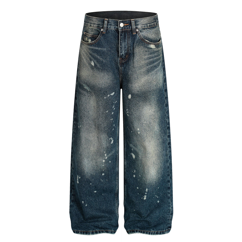 Front view of wide-leg jeans in dark vintage wash with white paint splatters