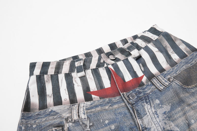 Waist detail showing striped upper layer and red star graphic above denim front