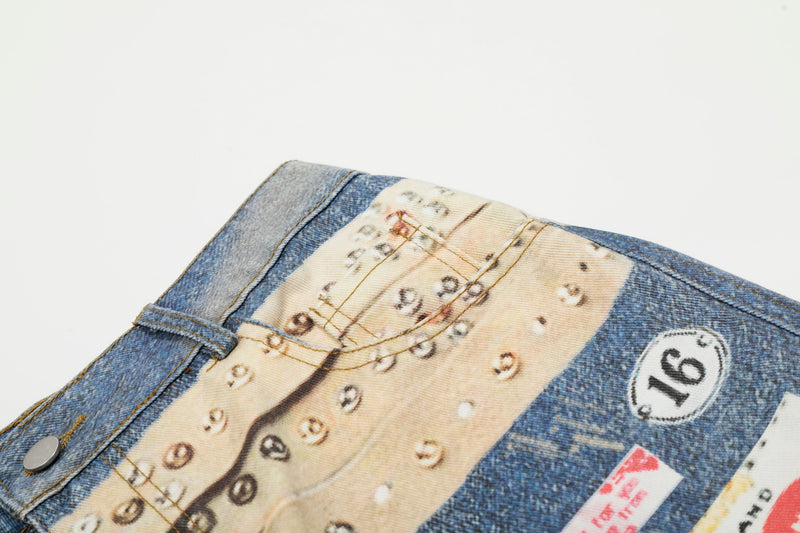 Close-up of waistband and printed studs on blue denim jeans from a slight angle