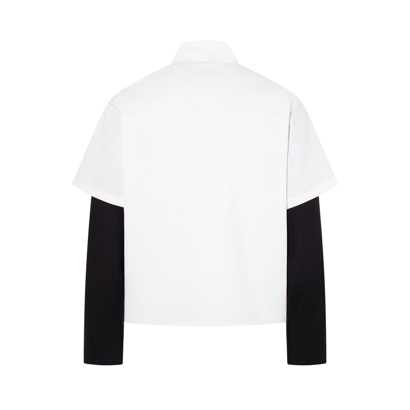 Back view of white layered shirt with black long sleeves and plain back panel