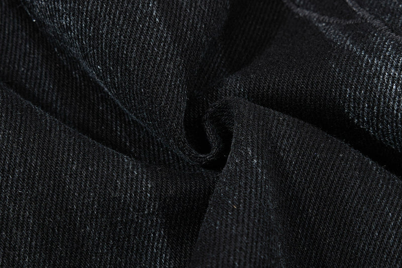 Close-up of black denim fabric texture and twill weave