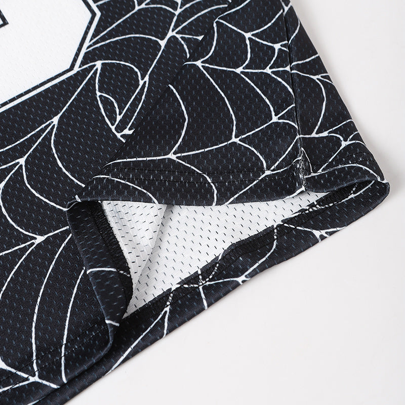 Black mesh football jersey with white spiderweb print and contrast sleeve hem detail