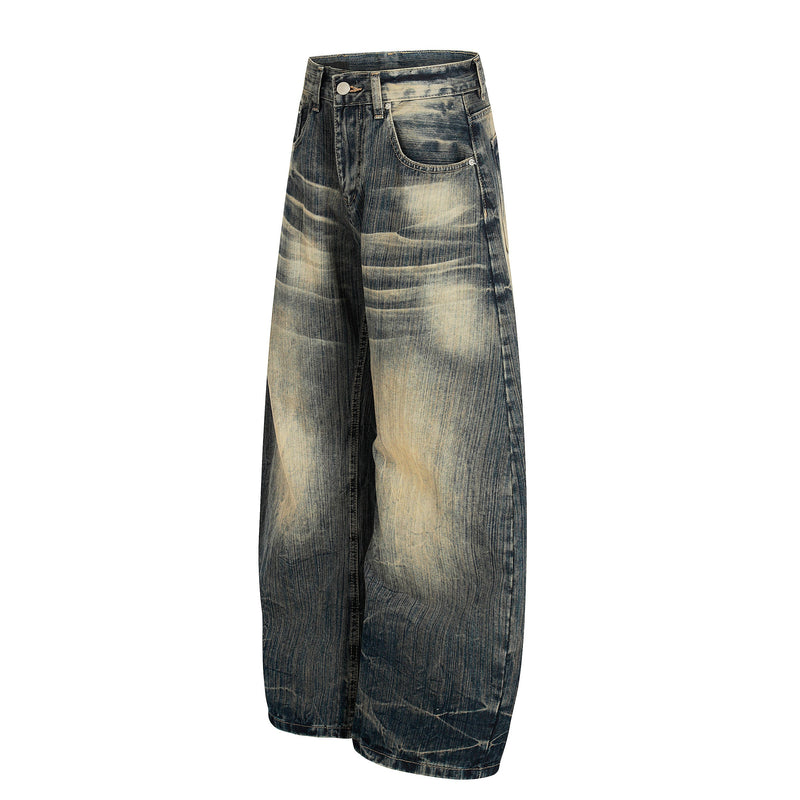Front angled view of vintage washed wide-leg denim pants with loose legs
