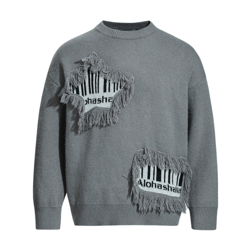 Gray knit sweater with two fringe patch graphics on the front