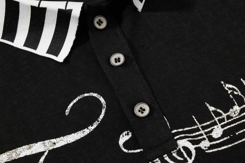 Black men's polo shirt with white music script print, button placket, and vintage streetwear style detail