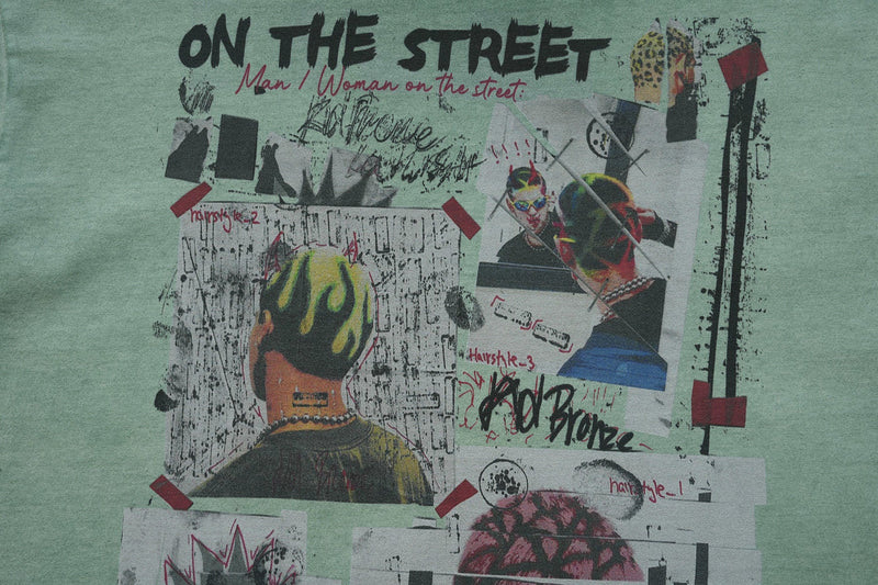 Mint green vintage wash graphic tee with edgy collage artwork and bold On the Street lettering