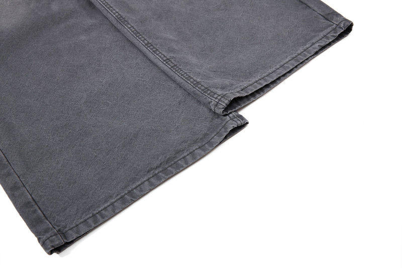 Close-up of charcoal denim folded hem and stitching