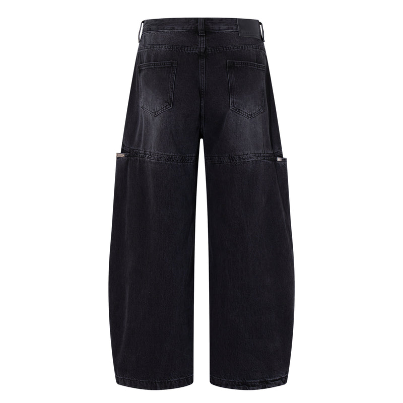 Back view of dark wash wide-leg jeans with patch pockets and split-panel seams