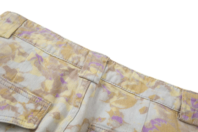 Close-up of the back waistband detail and pocket flap on abstract camo cargo pants