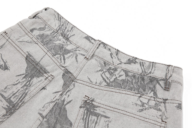 Close-up of the back waistband, belt loop, and pocket area on gray denim pants