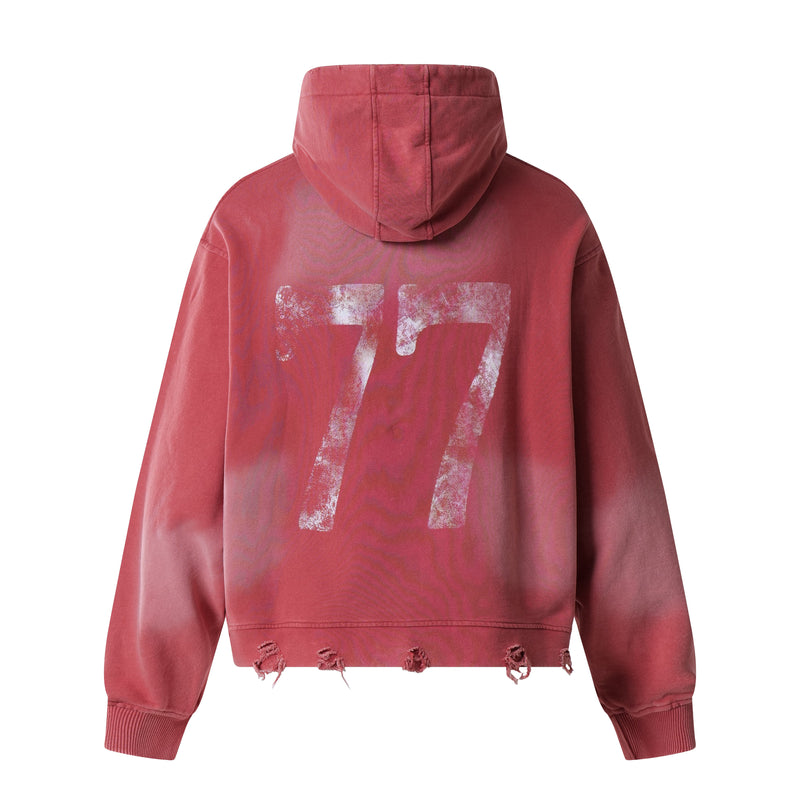 Red distressed graphic hoodie showing the back with large faded number 77 print