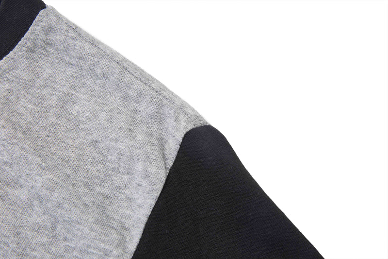 Close-up of a Beatles vintage graphic T-shirt with heather gray body and black contrast raglan sleeve