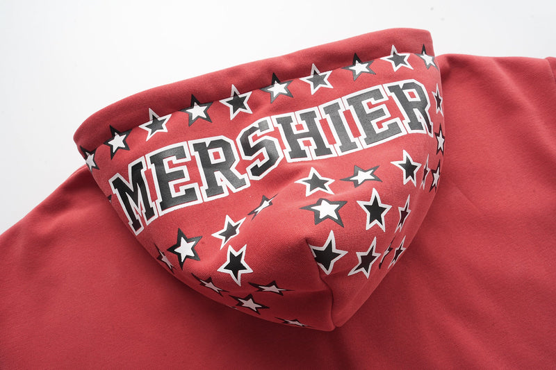 Angled close-up of red hood showing MERSHIER lettering and star print