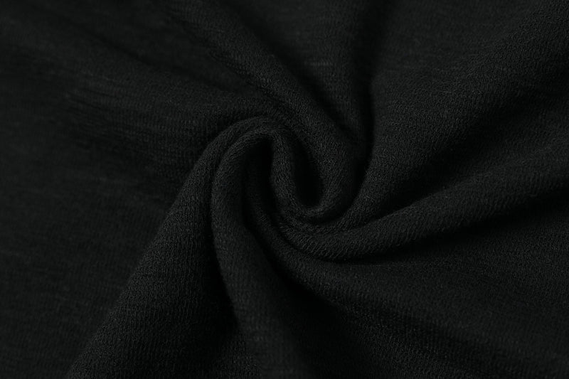 Close-up of black tee fabric draped in soft folds