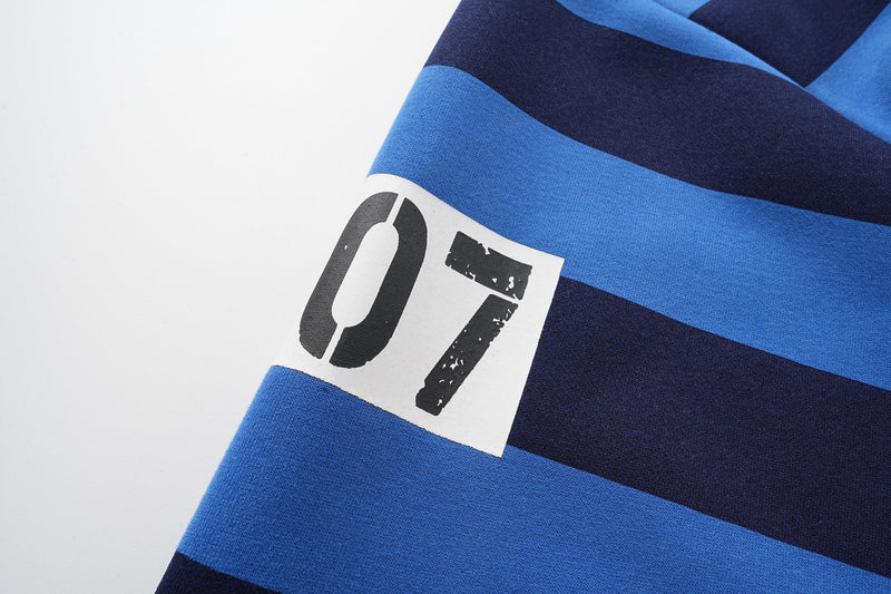 Close-up of number 07 patch on blue and black striped sleeve