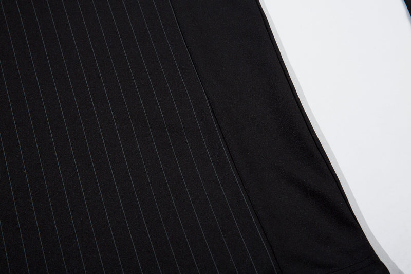 Close-up of black jersey side panel and pinstripe body fabric