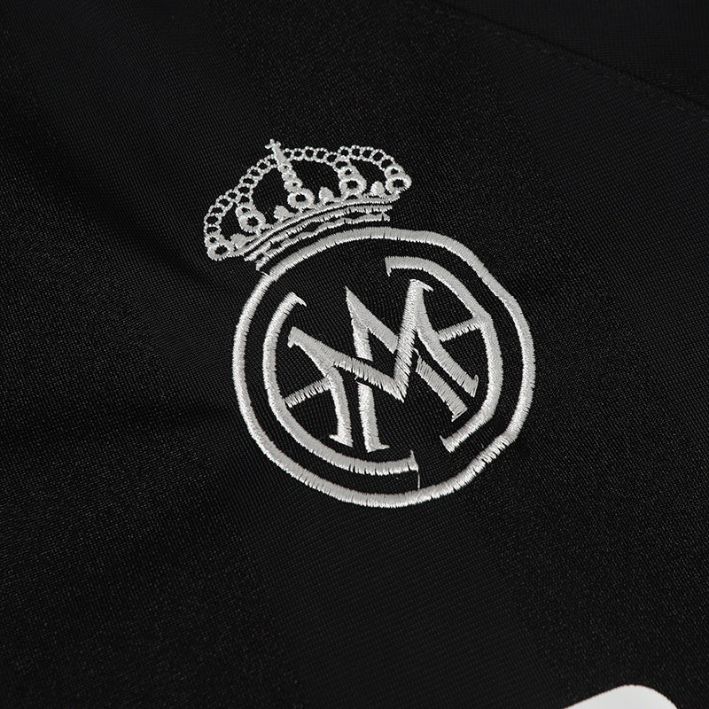 Black football jersey with embroidered white MADEGPSR crowned monogram on the chest, No. 9 design