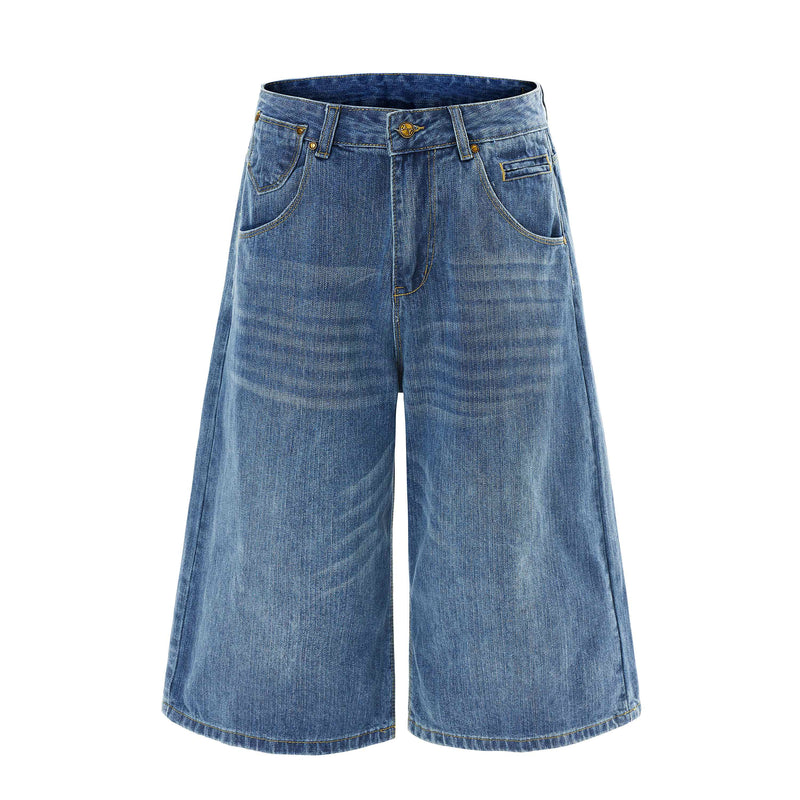 Front view of blue wide-leg denim shorts with curved front pockets and gold-tone button details