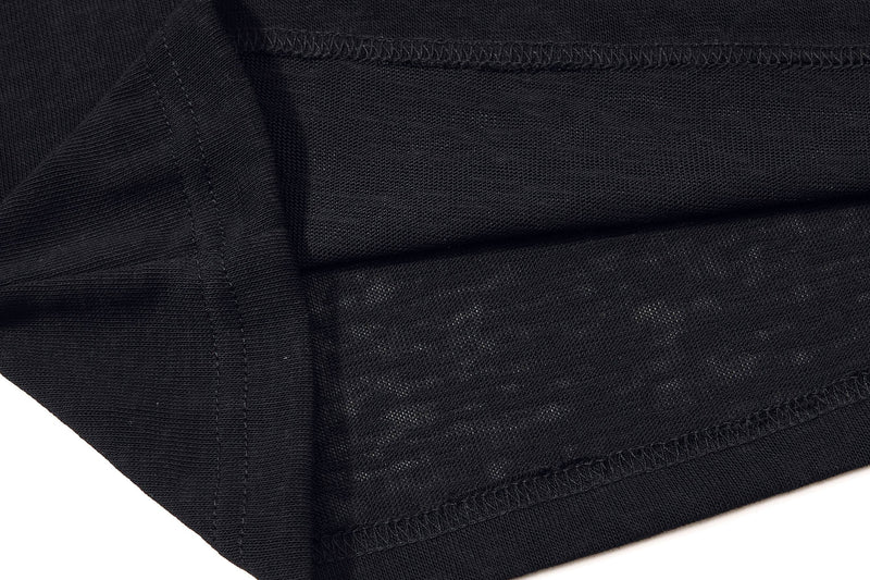 Close-up of black textured polo shirt hem with visible stitching and ribbed knit fabric detailing