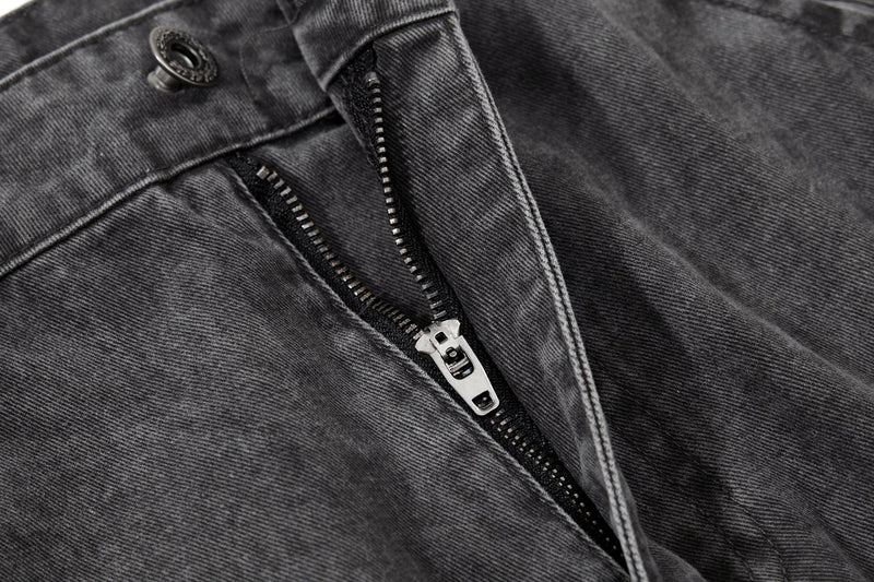 Close-up of front zipper fly on washed black cargo pants
