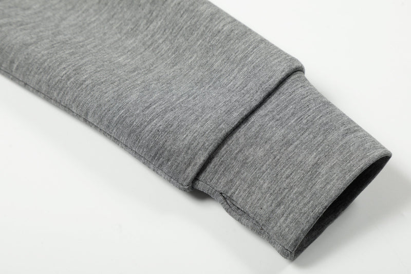 Close-up of grey ribbed sleeve cuff