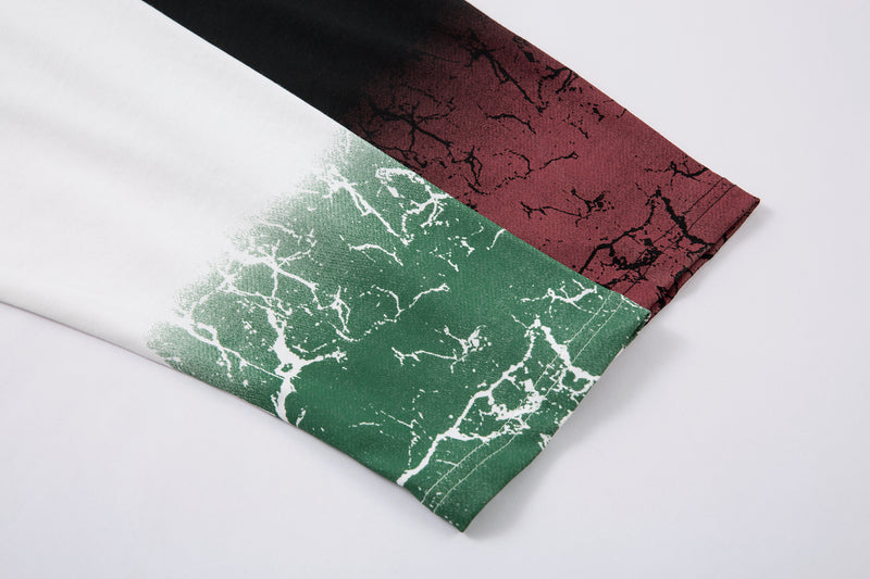 Close-up of long sleeve cuff with green cracked gradient print