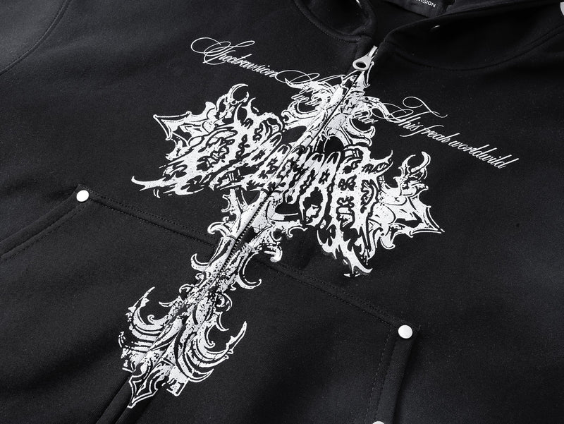 Close-up of black hoodie chest with white gothic cross graphic and front pocket snaps