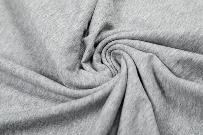 Gray knit fabric close-up folded into a swirl