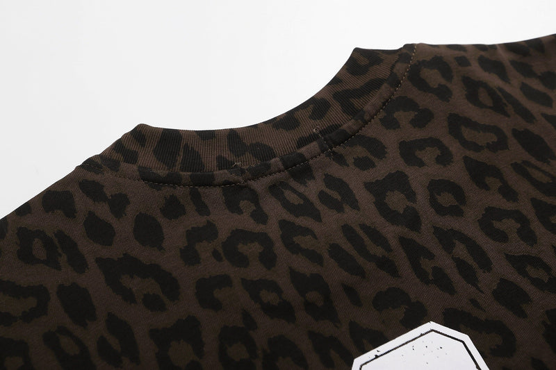 Close-up of a leopard print graphic T-shirt collar in dark brown and black Y2K streetwear style